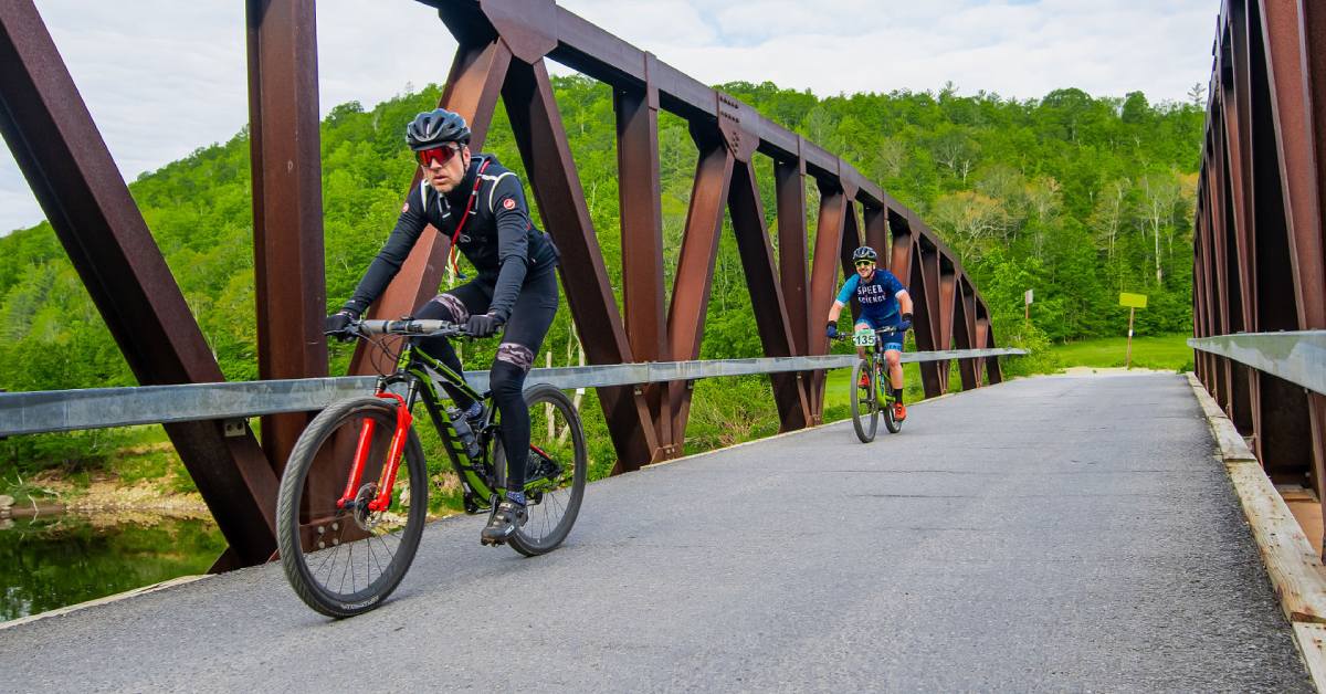 two cyclists on a bridge