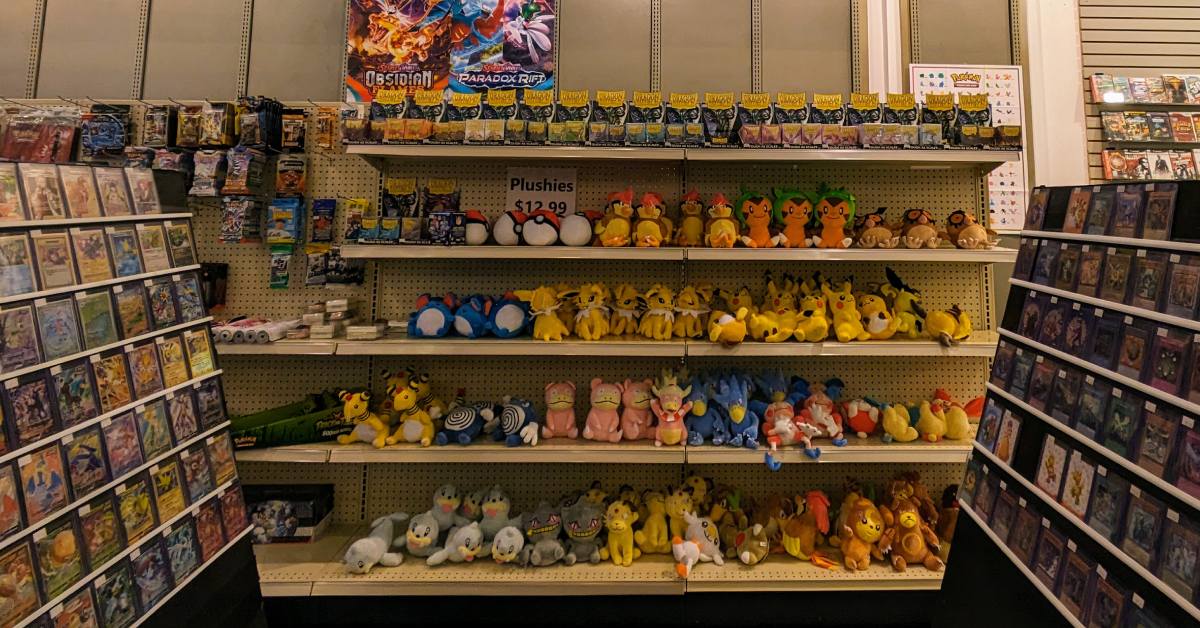 plushies and trading cards at a store in aviation mall