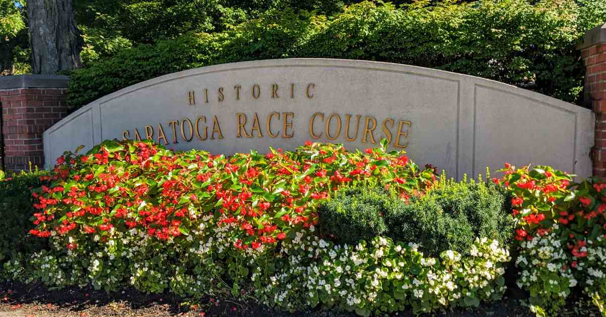 historic saratoga race course sign with flowers