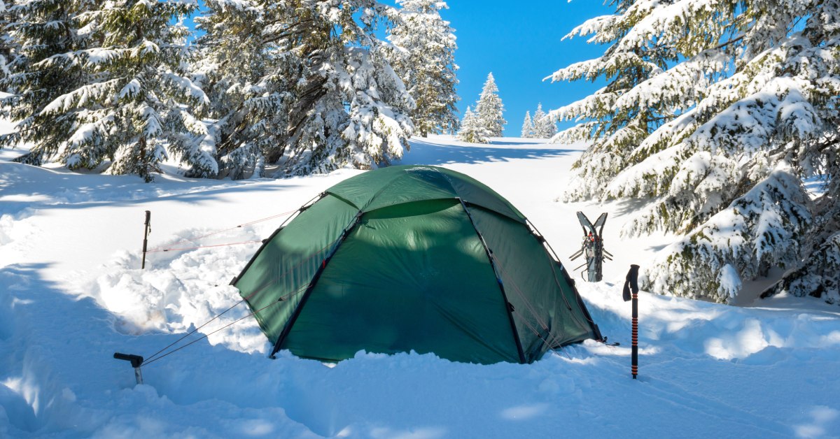 green tent in the snow in winter