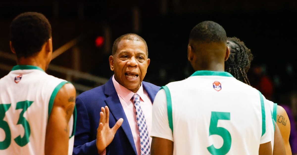 basketball coach speaking with players