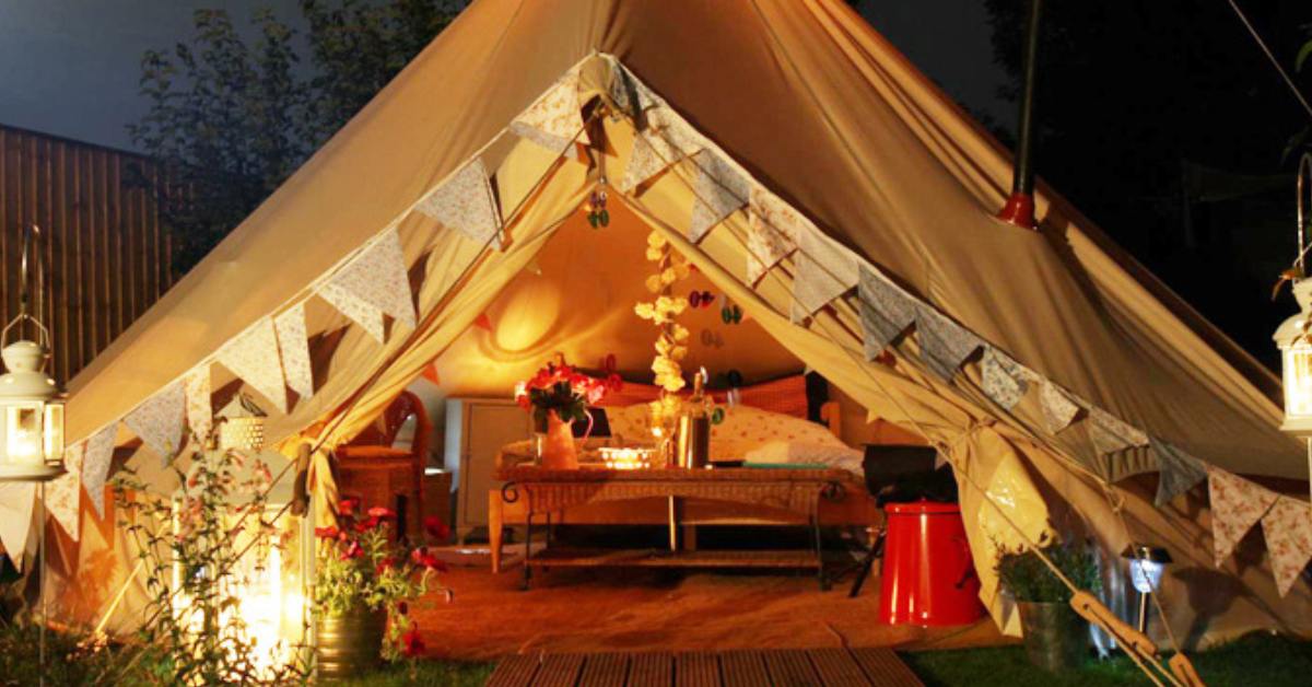 Decorated tent with a queen bed inside