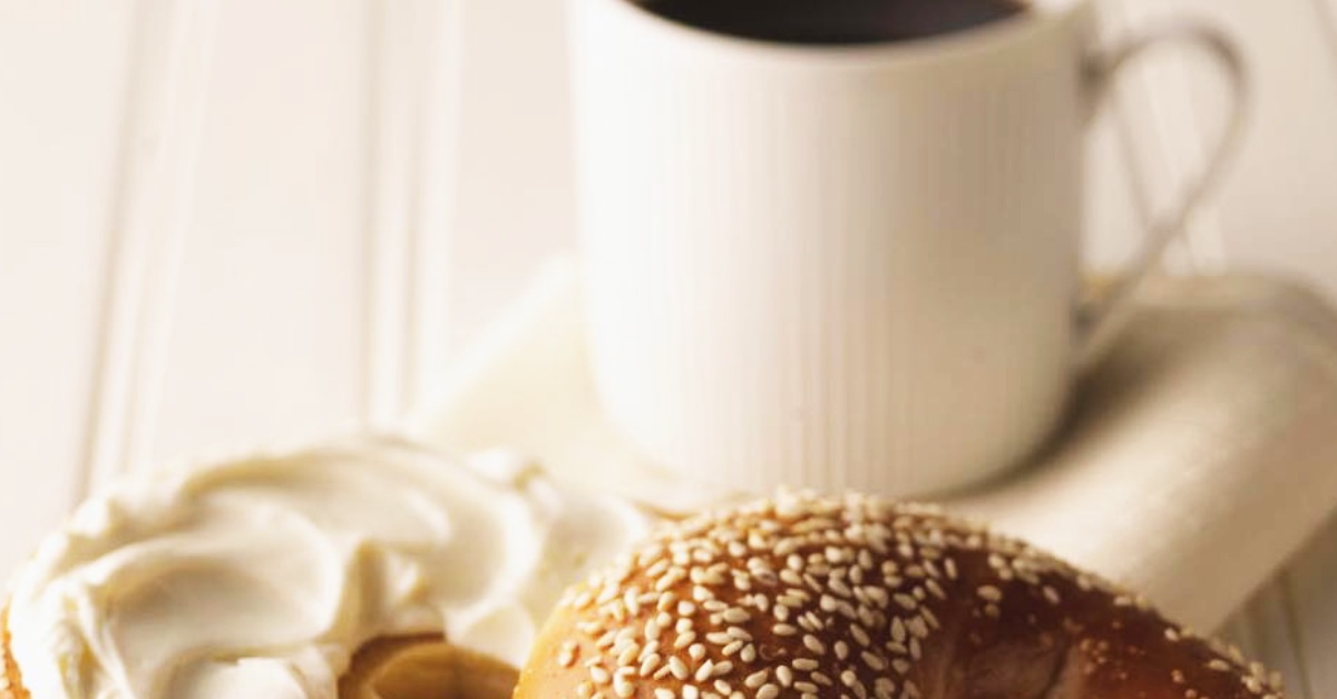 stock photo of coffee and bagel with cream cheese