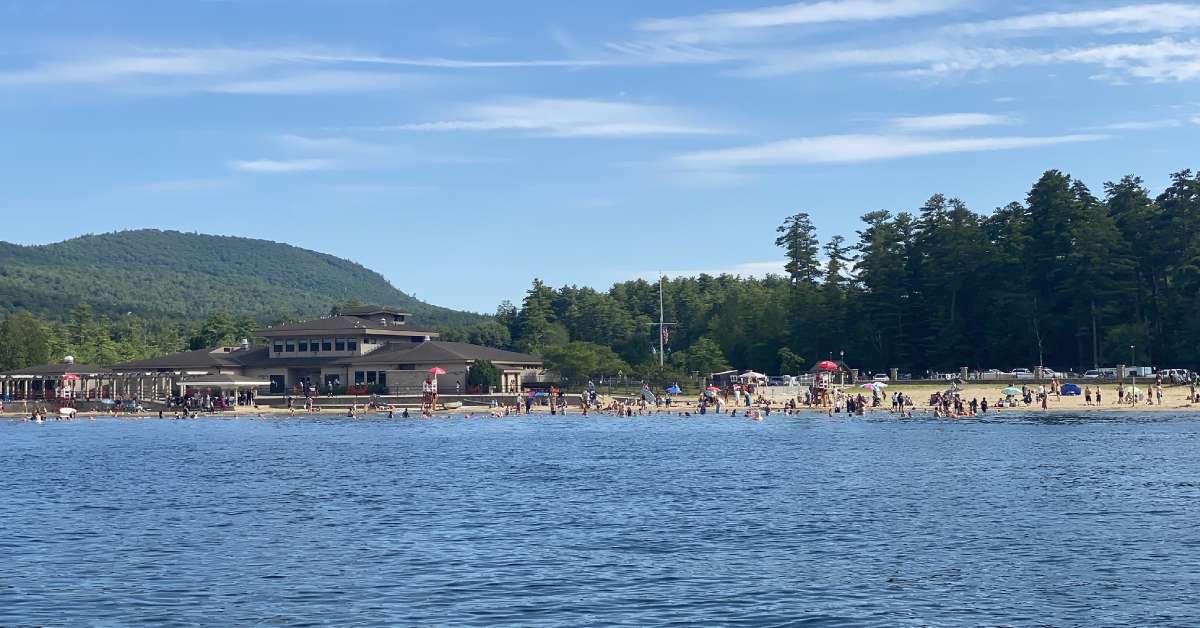 view of a beach and building from the water