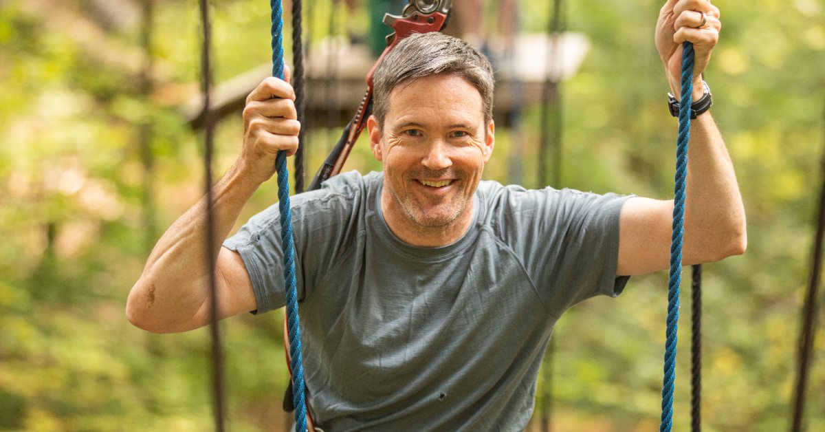 dad on treetop course at adirondack extreme