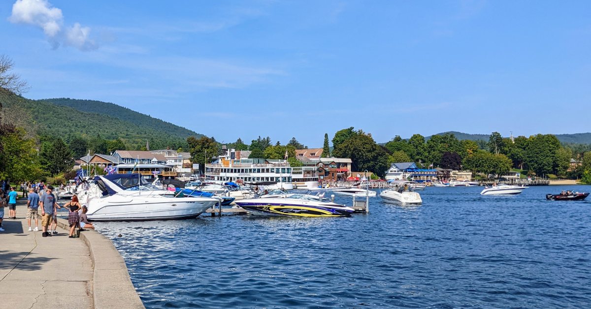 lake george walkway by water and boats