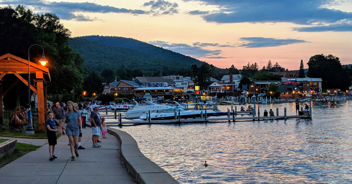 people by the lake at dusk