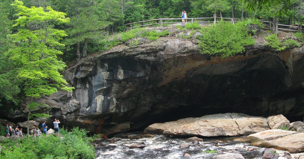 people at natural stone bridge and caves
