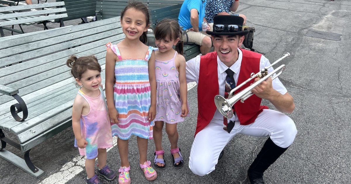 bugler poses with kids at saratoga race course