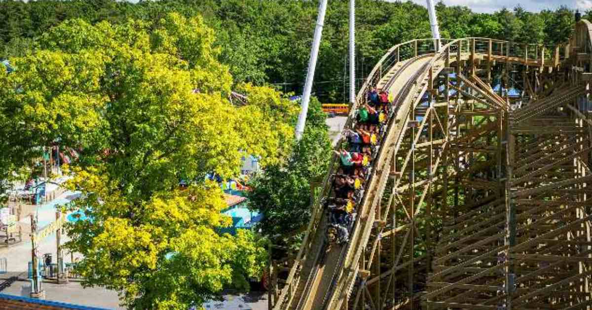 a roller coaster with people riding 