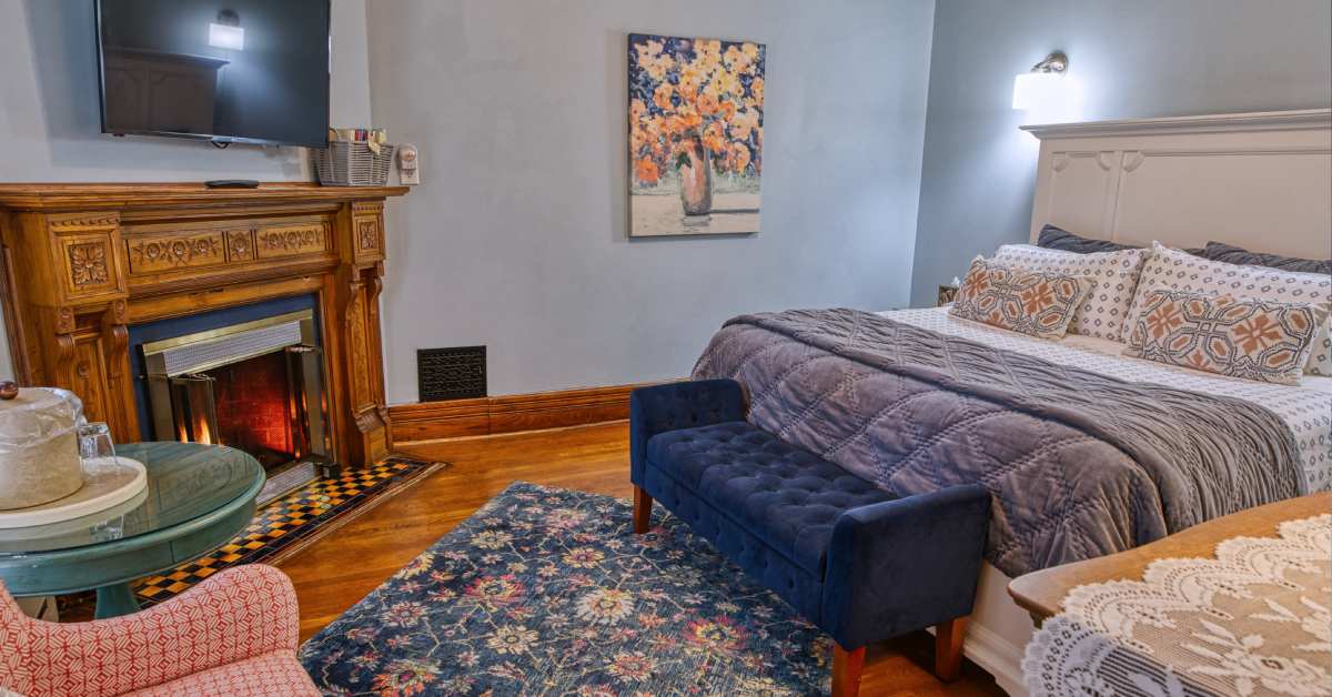 B&B room with fireplace and bed