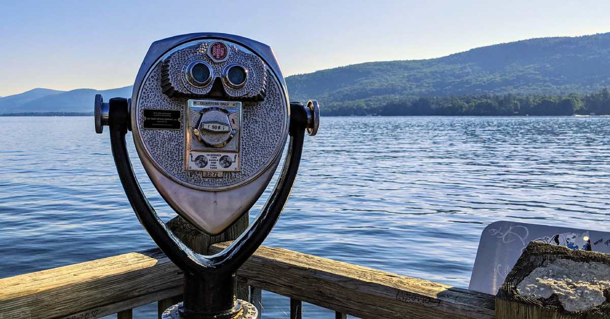 tourist binoculars looking out at lake