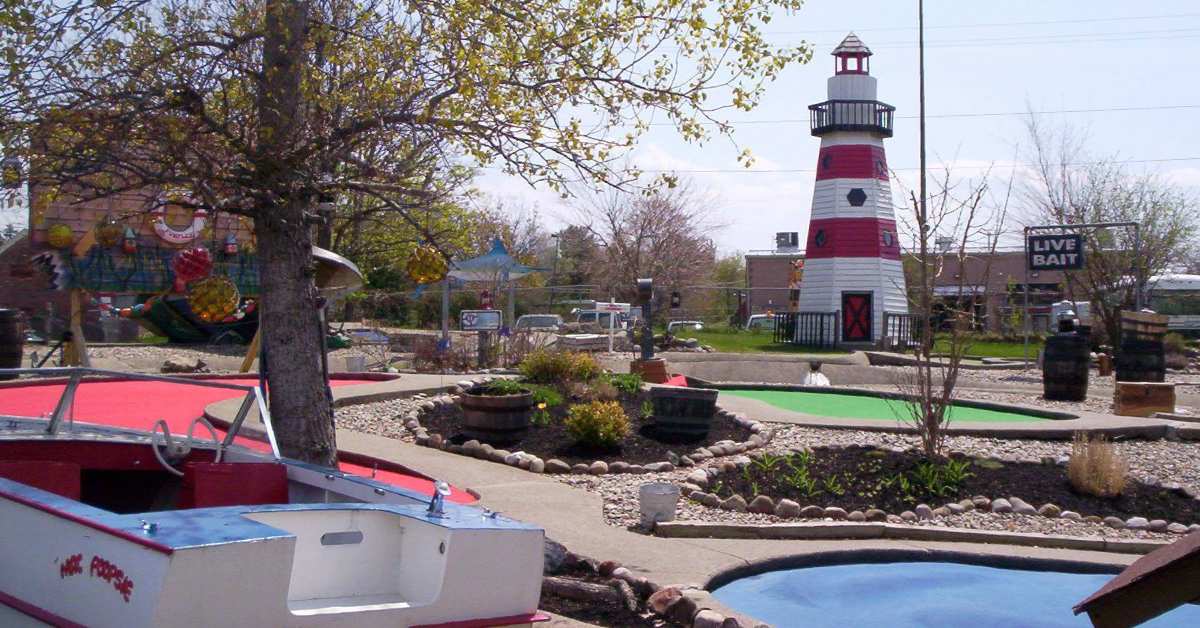 mini golf course with lighthouse and boat props