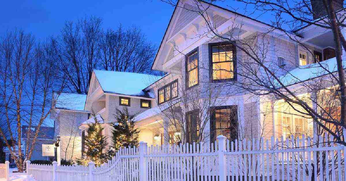 White house in Saratoga covered in snow