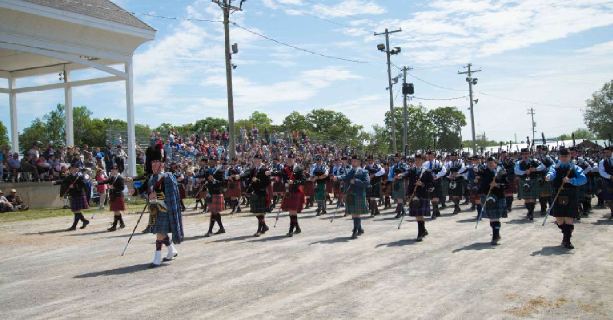 people dressed in kilts for a scottish parade