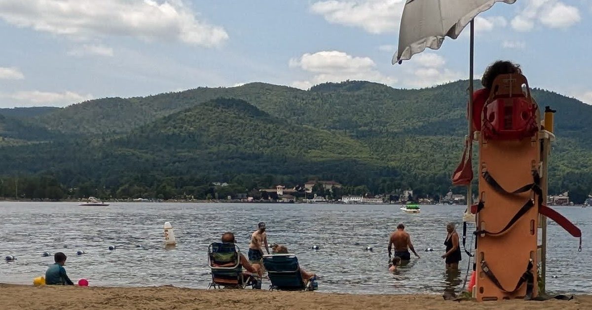 kids and adults at usher park beach in lake george