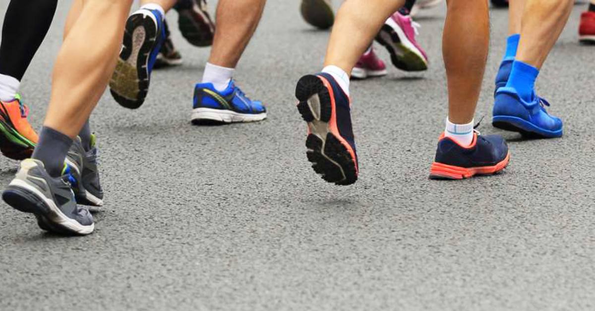 close up of sneakers while people are running