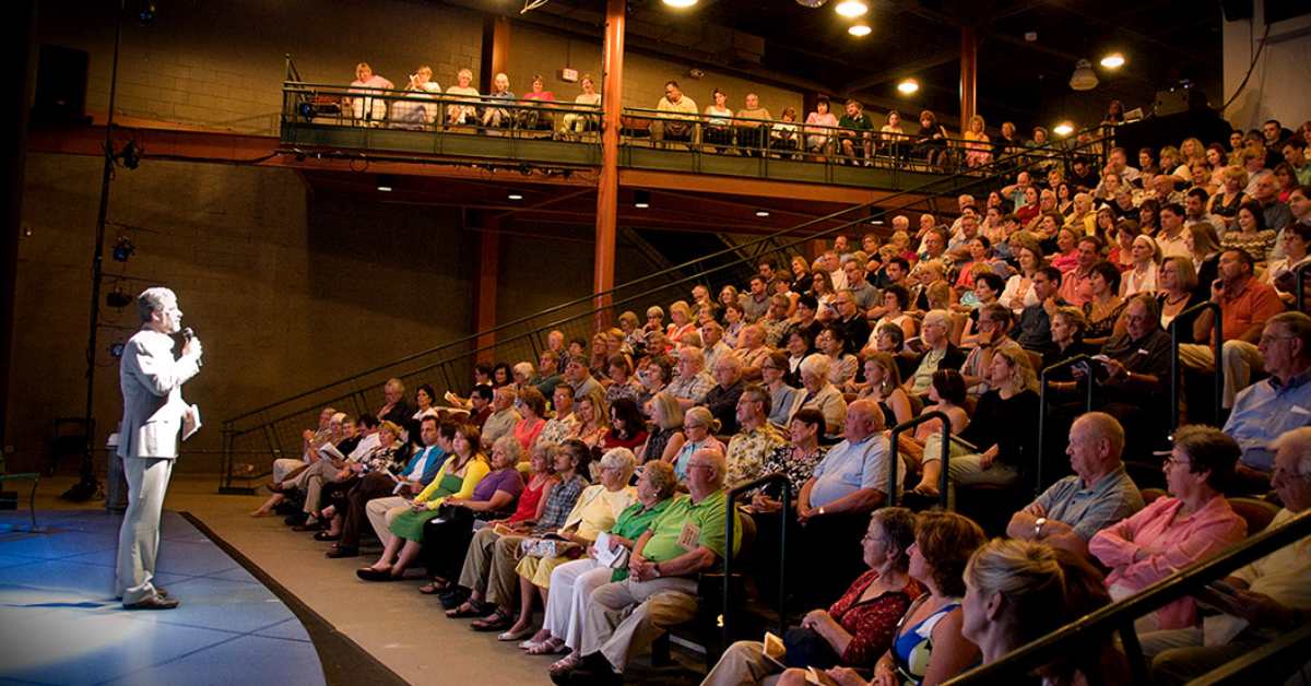 performer facing an audience