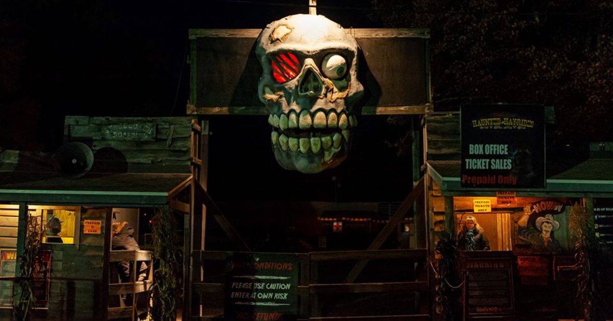 Entrance to haunted hayride with a giant skull