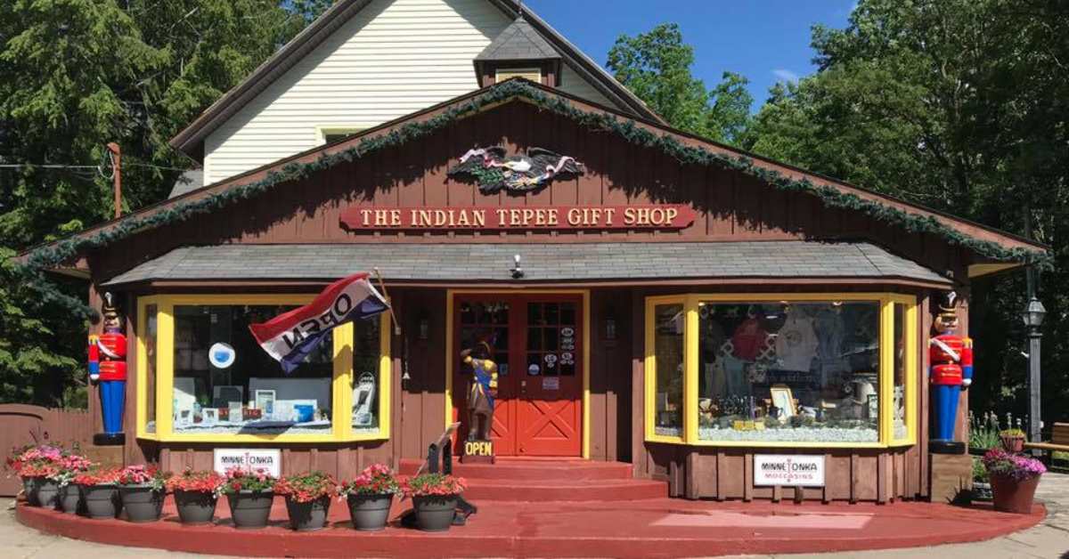 Storefront of brown building labeled the indian tepee gift shop