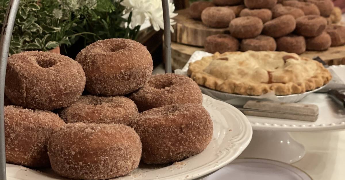 Platters with apple cider donuts and an apple pie