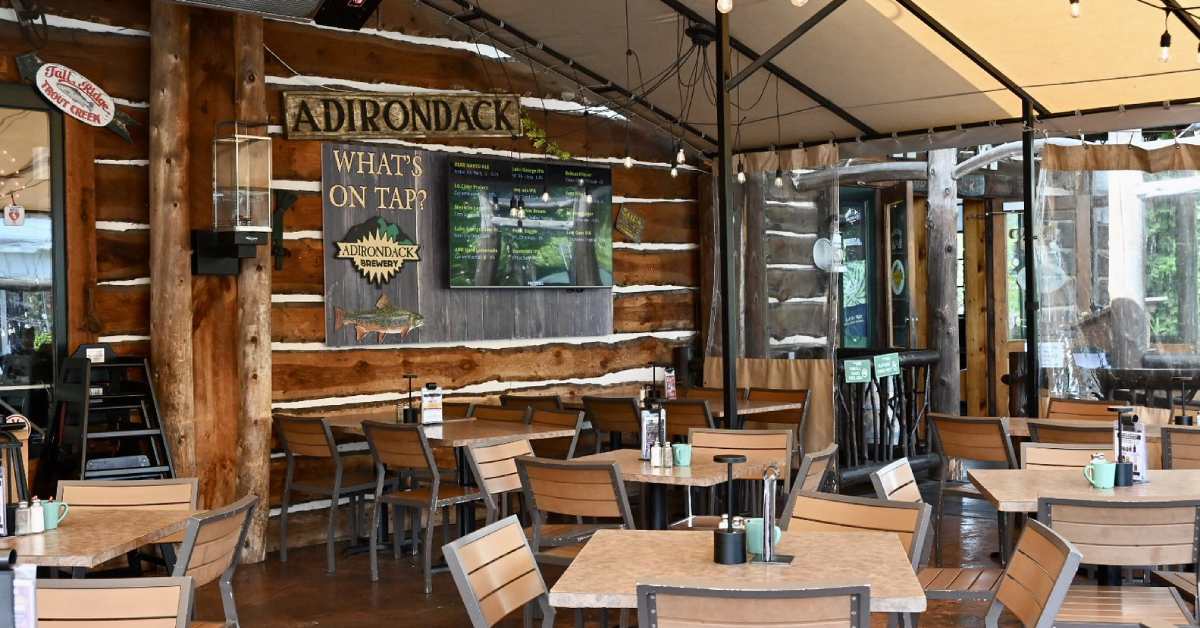 restaurant covered porch with tables and chairs