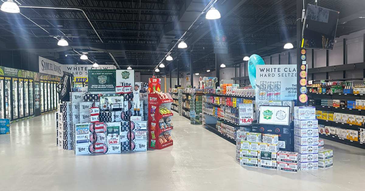 inside of beverage center with beer displays and alcohol on shelves