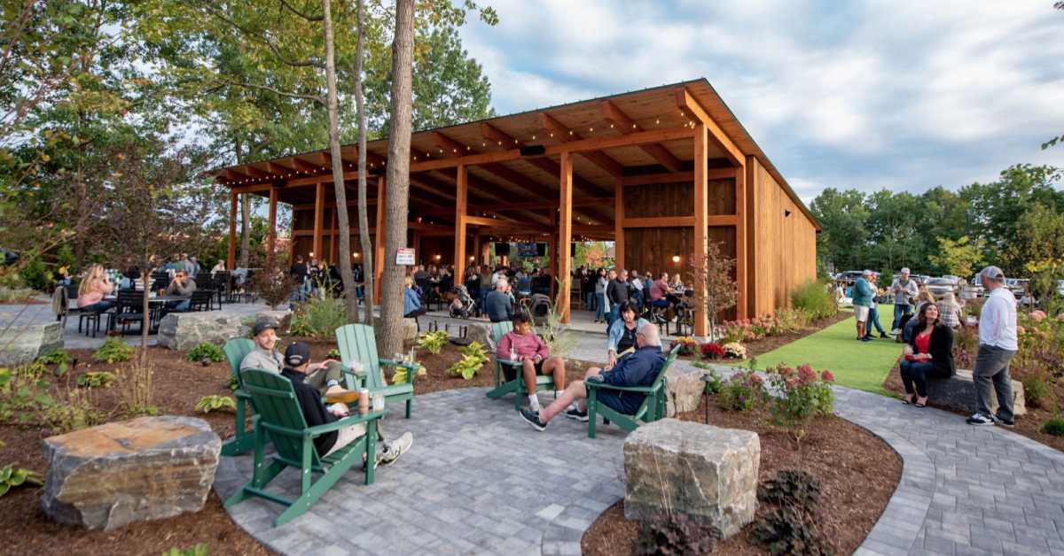 people outdoors at a beer garden patio space