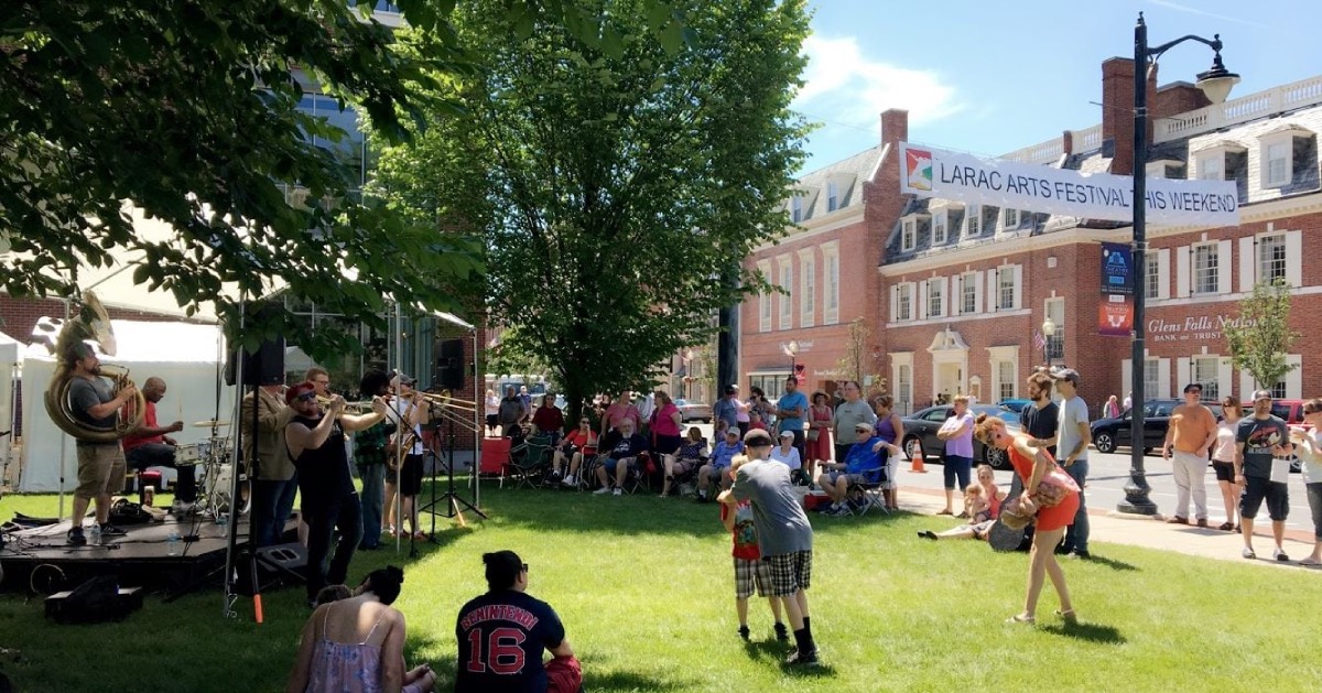 people at an outdoor festival with music