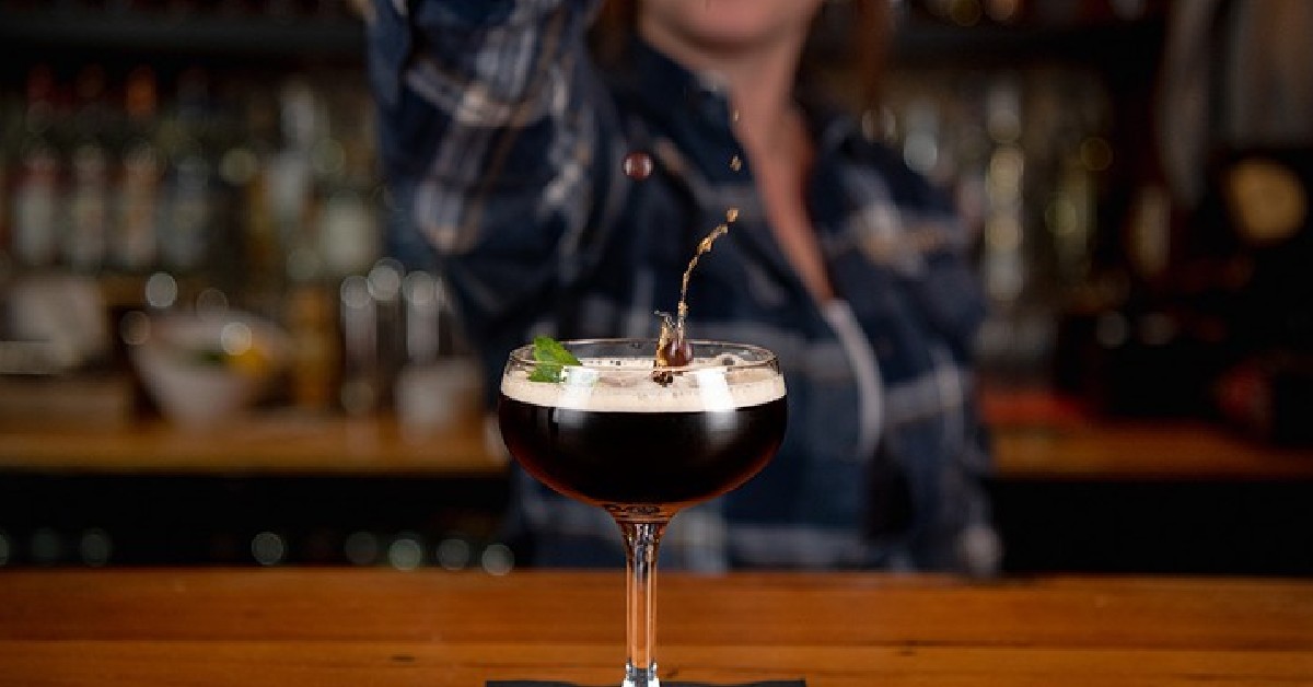 cocktail in front of bartender 