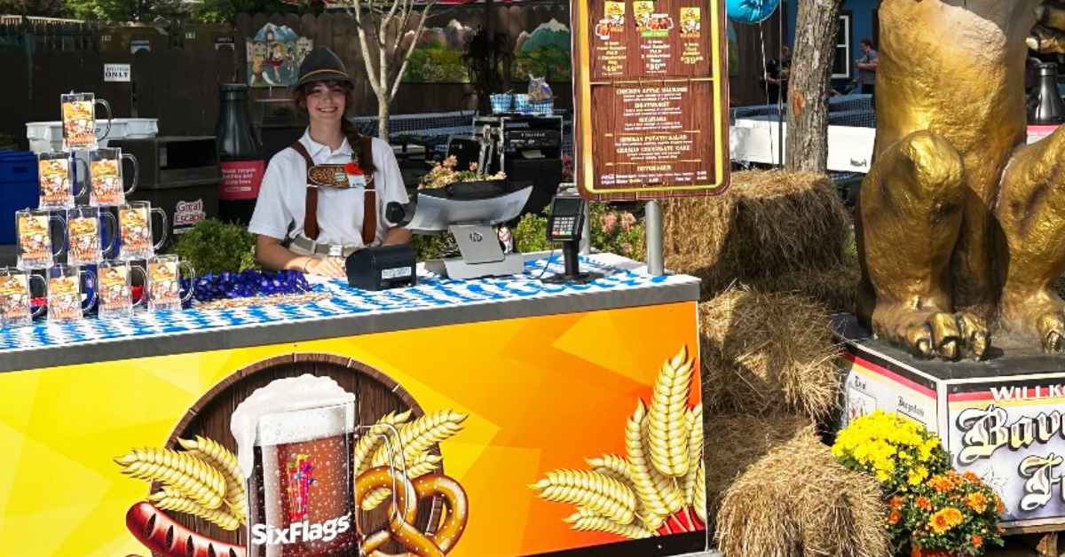 oktoberfest themed food stand with worker