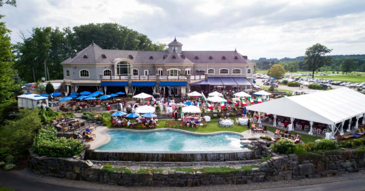 large outdoor patio at restaurant with infinity pool