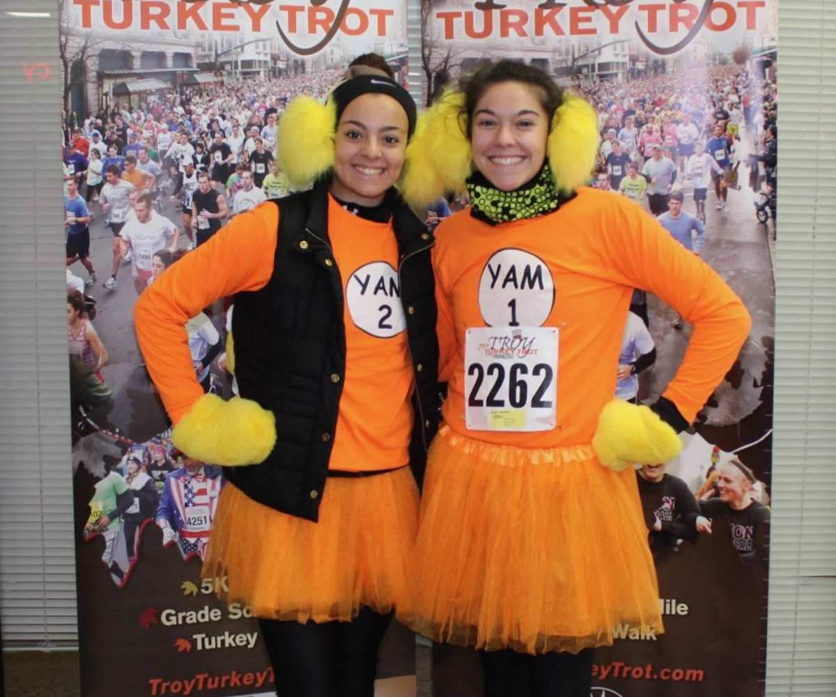 two women wearing turkey troy outfits