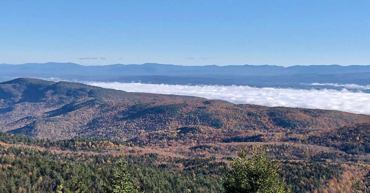 view of mountains with fog