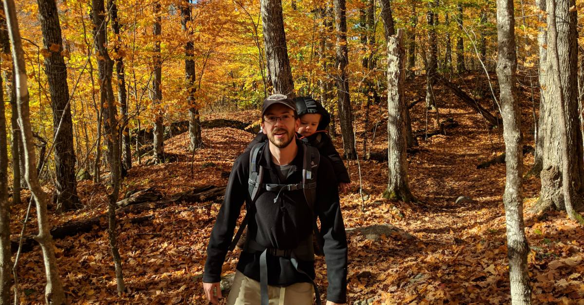 dad and toddler hike in fall