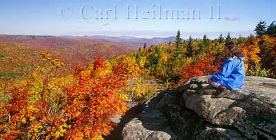 woman at hadley mountain summit in fall