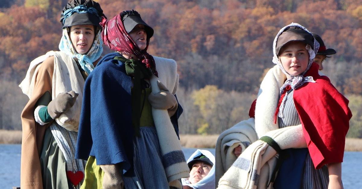 period actors with fall foliage in background