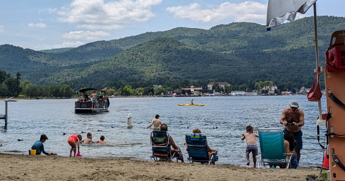 kids play at ushers park beach in lake george