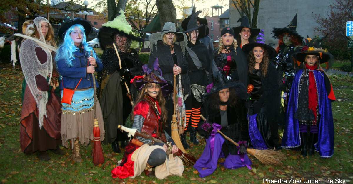 group of women dressed as witches for halloween event