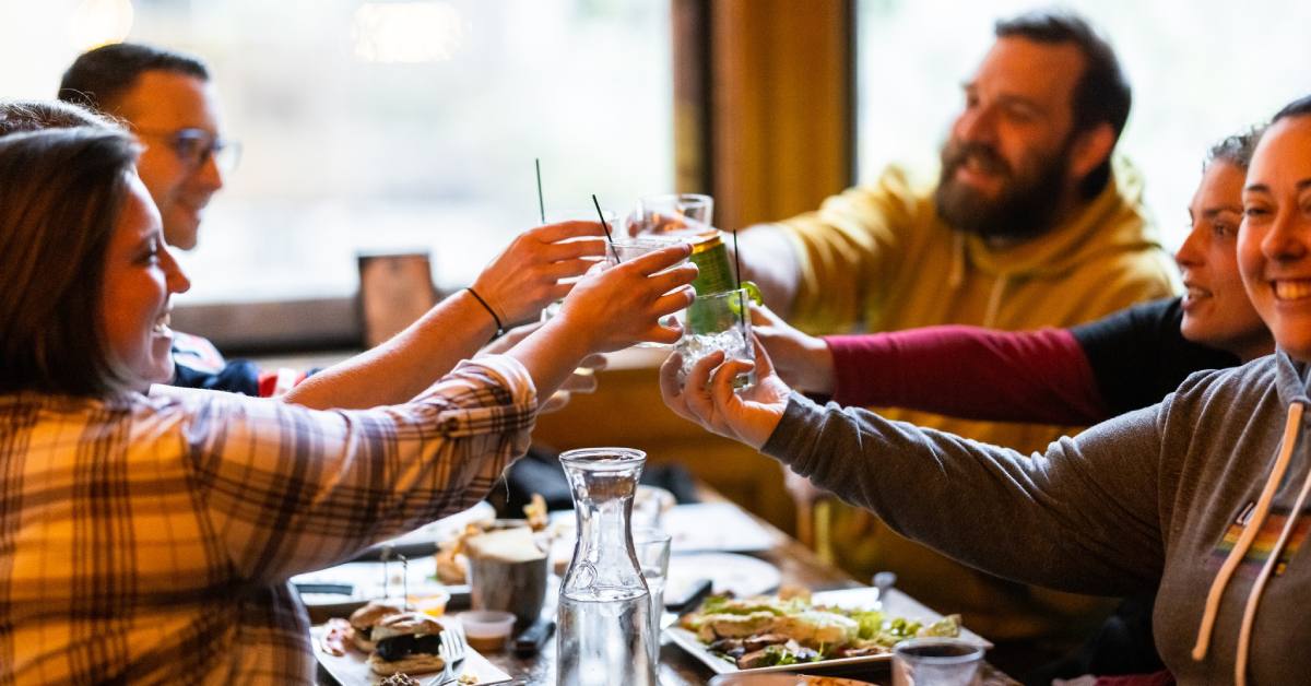 group of people enjoying drinks at a table