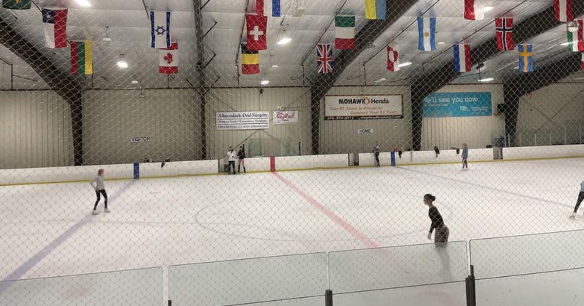 people ice skating indoors