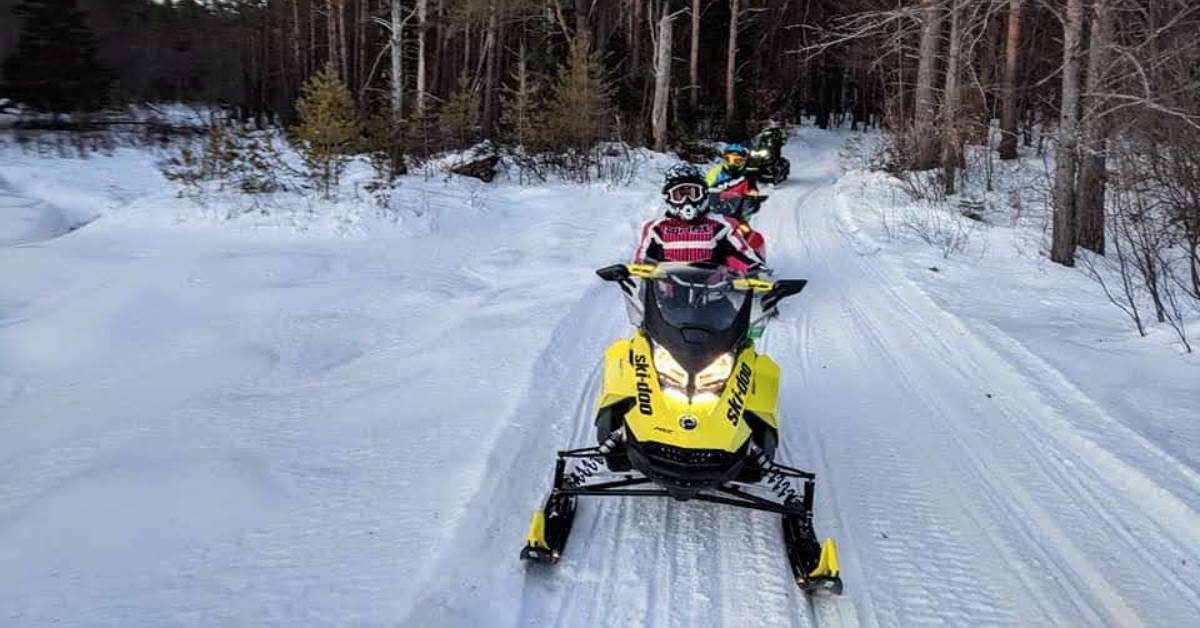 snowmobilers on trail