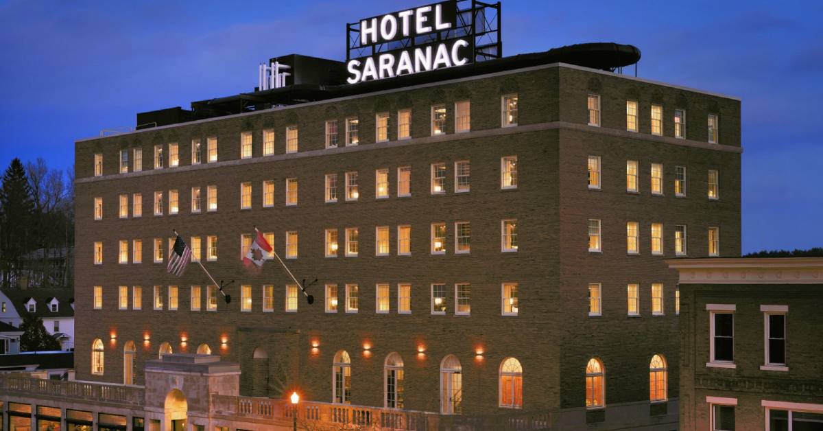 exterior of hotel saranac in the evening