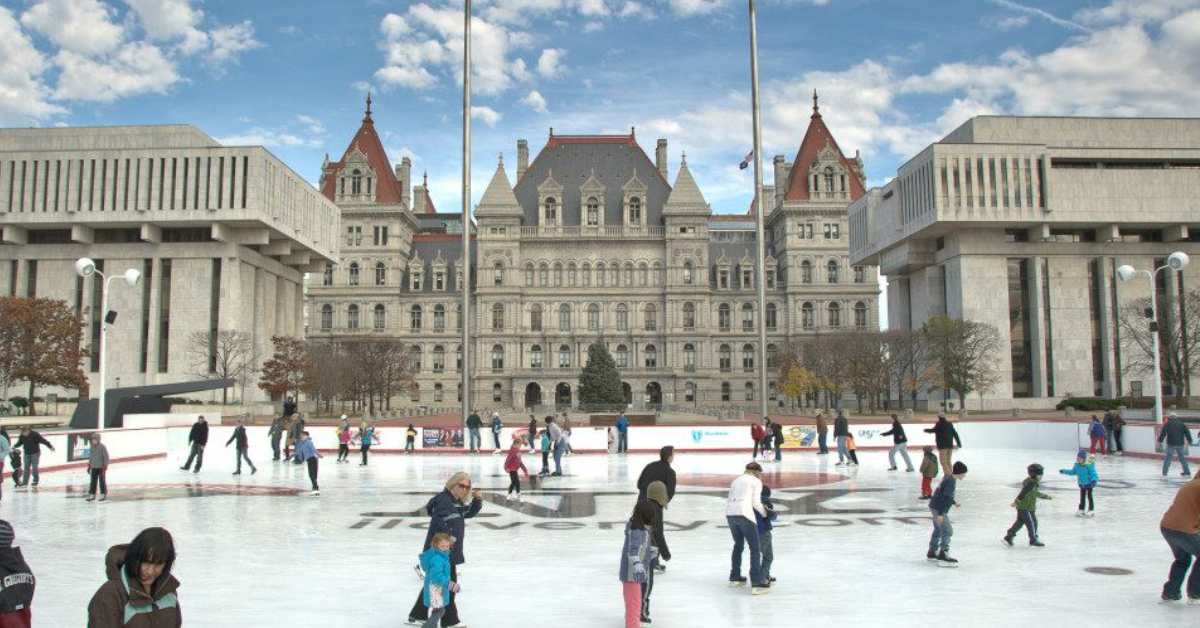 people ice skating at the empire state plaza in Albany