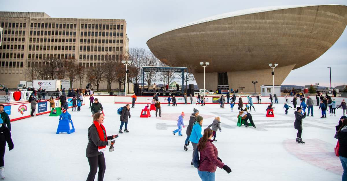 people ice skating outdoors near The Egg in Albany