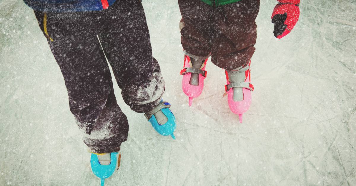 two kids with ice skates on