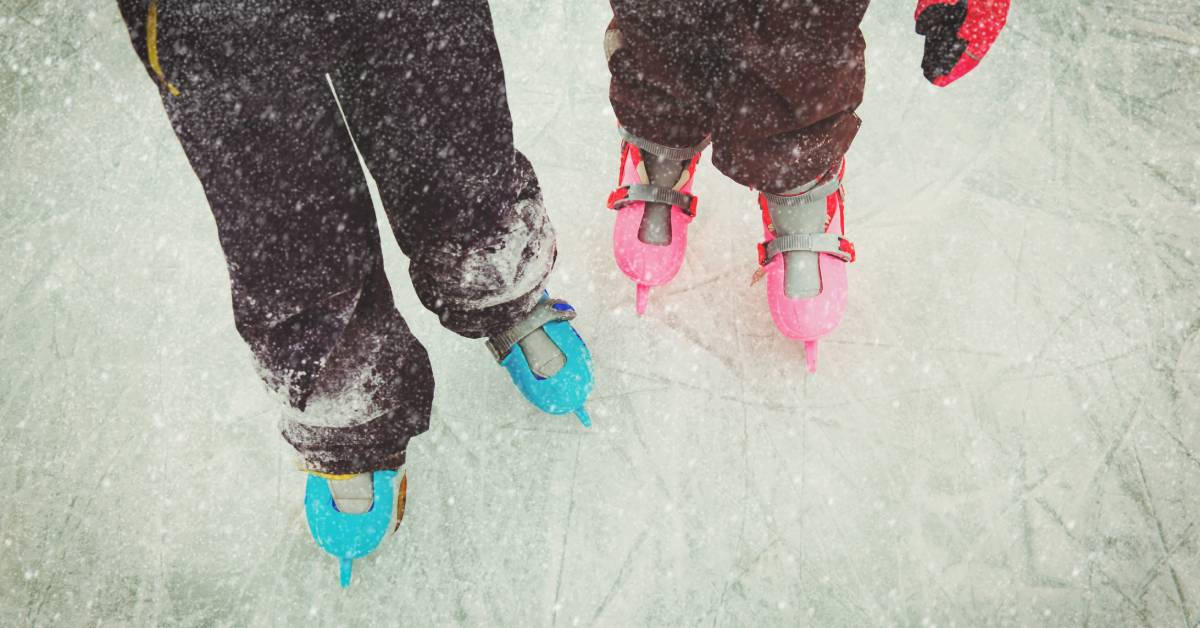 two kids wearing ice skates