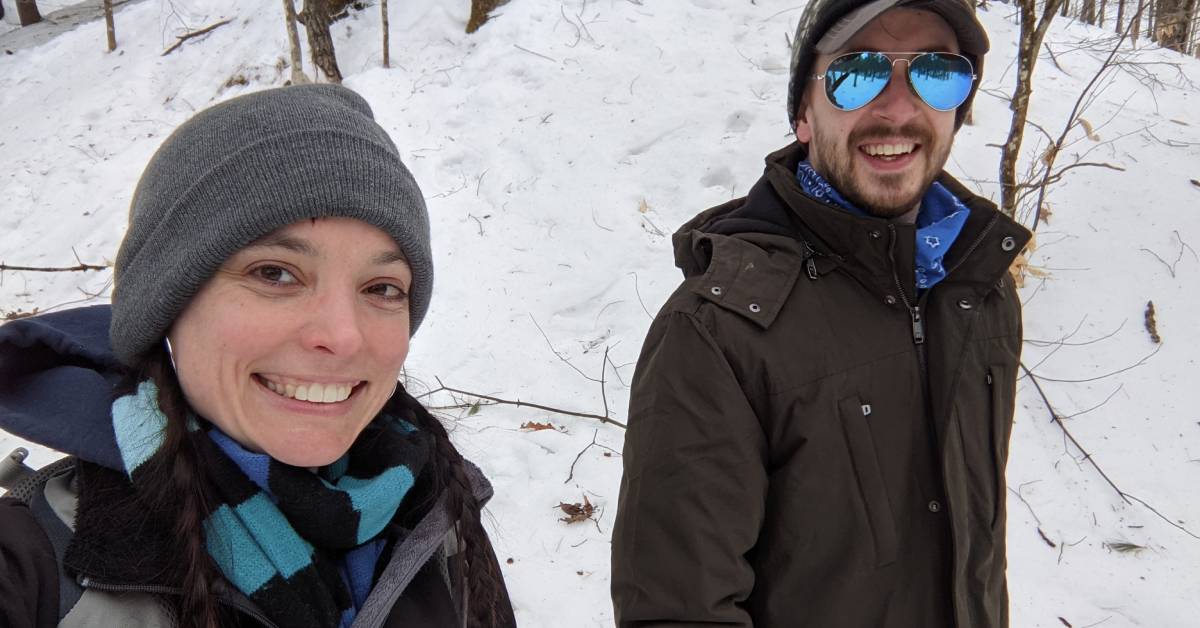 couple walks through snow