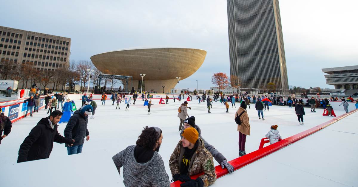 people ice skating outdoors near The Egg in Albany