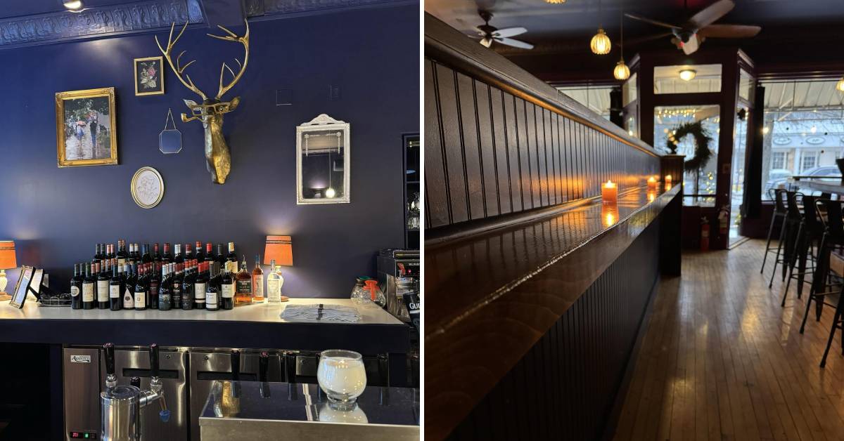 bar with fake dear head and candles along wall in restaurant